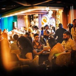 a group of people sitting at a restaurant