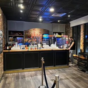 a man standing at a bar