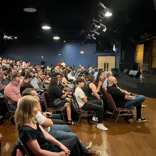 a crowd of people in a theater