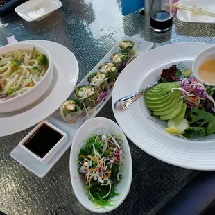 Udon noodles. Summer roll. Seaweed salad. Asian Felt Green salad w/avocado.