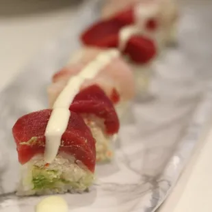 Candy Cane
Crabmeat,Avocado ,Soy Paper, Tuna &amp; Yellowtail on top