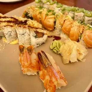 a plate of sushi and shrimp