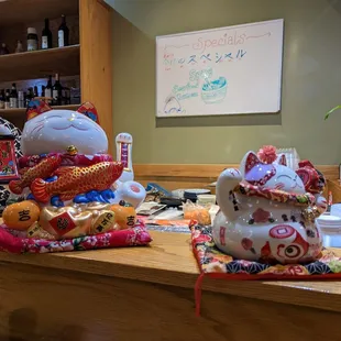Maneki neko on the counter inside