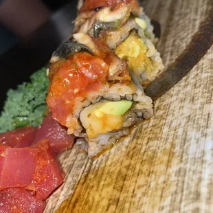 a sushi roll on a wooden board