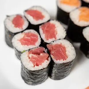 a plate of sushi and vegetables