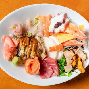 a plate of sushi and sashimi