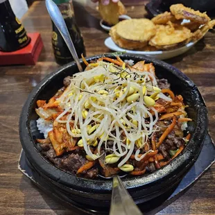 Bulgogi bowl with sweet potato tempura in the background