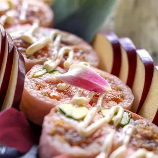 a plate of sliced meat and vegetables
