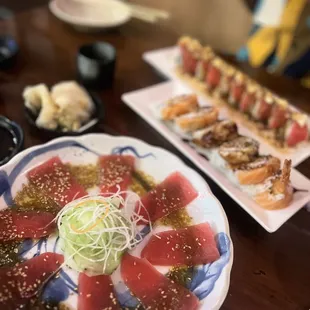 a variety of sushi on plates