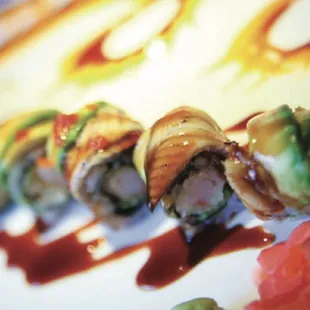 42.tiger roll(tempura shrimp with ell ,avocado masago and ell sauce on the top)
