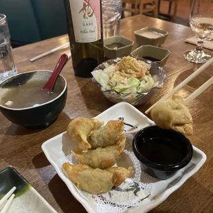 a plate of food and a bottle of wine