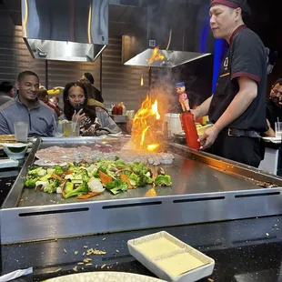 a man grilling food