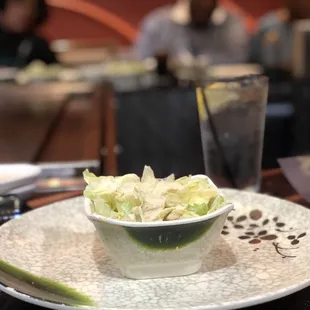 a bowl of salad on a plate