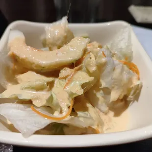 Standard side salad with iceberg, cucumbers, carrots, and ginger dressing.  Comes with combo dinners.