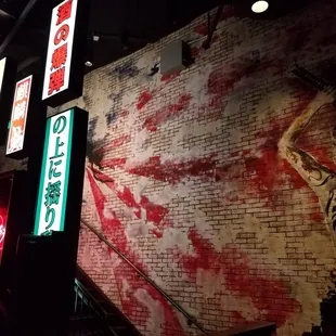 a brick wall with neon signs