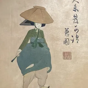 a woman with a hat and a cane