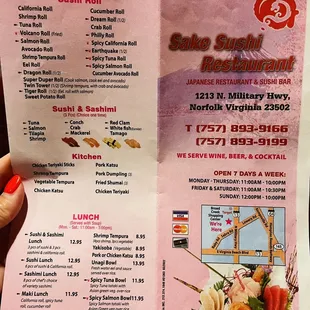 a person holding a menu