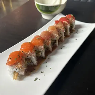 a sushi roll on a white plate