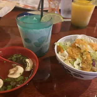 Clear soup, margarita, and salad with ginger dressing