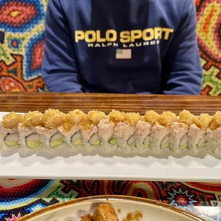 a plate of sushi rolls