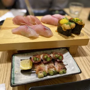 Trifecta on the right, Bacon wrapped asparagus on the bottom, misc great nigiris behind