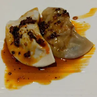 Steamed Spicy Dumplings - stuffed with shrimp, chicken and mushroom and served with a heavenly chili sesame oil.