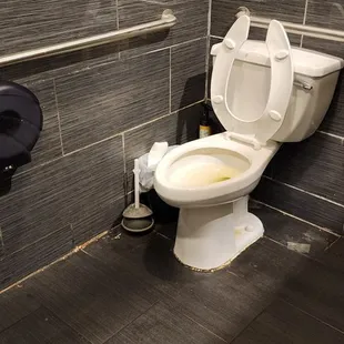 a toilet in a public restroom