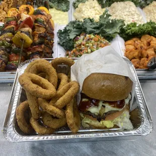 Double cheeseburger deluxe with onion ring&apos;s.