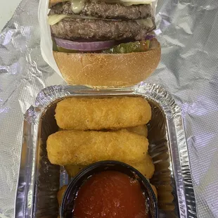 OMG delicious food double cheeseburger , mozzarella stick.