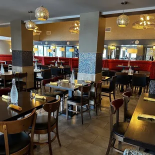 a restaurant with tables and chairs