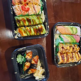 Top: Kamikaze Roll/ Green Dragon roll Below: 2 Eel Sushi Right: Rainbow Roll/can&apos;t remember the last one