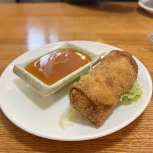 a plate of food with dipping sauce