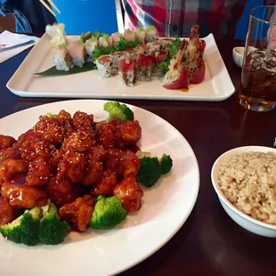 Sesame chicken with brown rice, and 3 sushi rolls (the Pottstown roll,  the green river roll, and I forget the last one)