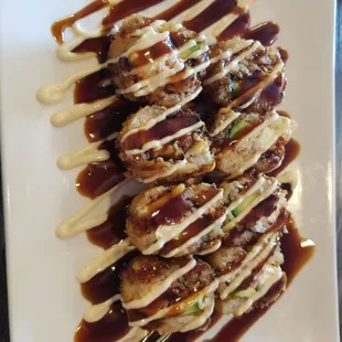 The Double Roll. Cream cheese, avocado, shrimp and all fried with eel sauce on top. Delicious!