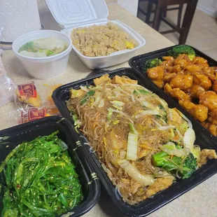 Pad woosen, Orange chicken, fried rice, seaweed salad, and wonton soup.