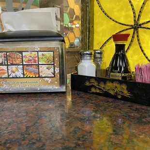 a table setting with napkins and condiments