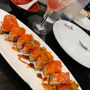 a plate of sushi and a drink