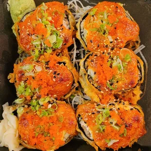 a plate of sushi rolls