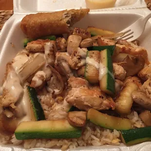 Hibachi chicken w/ rice, mushrooms, onions, zucchini, and sauce. And an egg roll