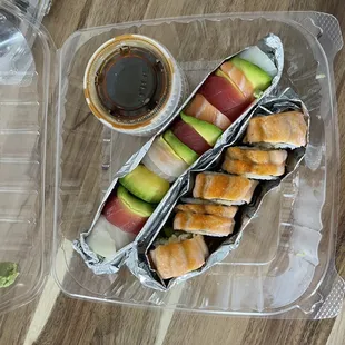 a plastic container with sushi and avocado