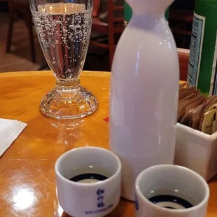 a table with two cups of coffee