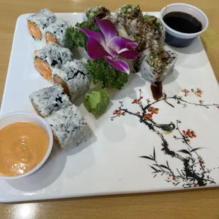 Spicy yellowtail roll and eel roll with a side of eel sauce and spicy mayo