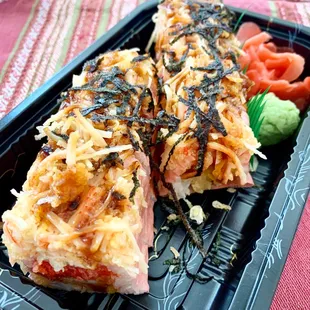 Masa Roll: Shrimp tempura, spicy tuna &amp; mango wrapped w. soy paper top w. spicy crab and seaweed