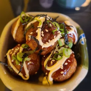 Takoyaki - Japanese fried fritters with octopus in them. A popular street food in Japan.