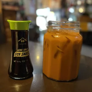 Thai tea, pictured with soy sauce bottle for size