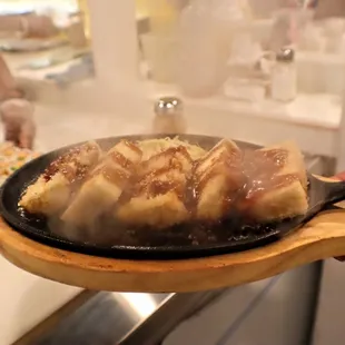 food being cooked in a frying pan