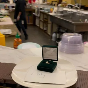 Engagement ring on the sushi train