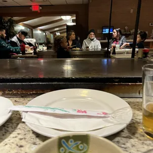 Picture of the little girl running behind the grill...this place is an OSHA nightmare!