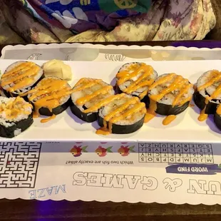 a plate of sushi rolls