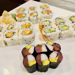 a plate of sushi rolls